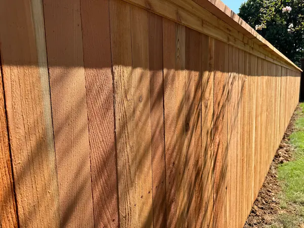 Stained cedar residential privacy fence in Fort Worth